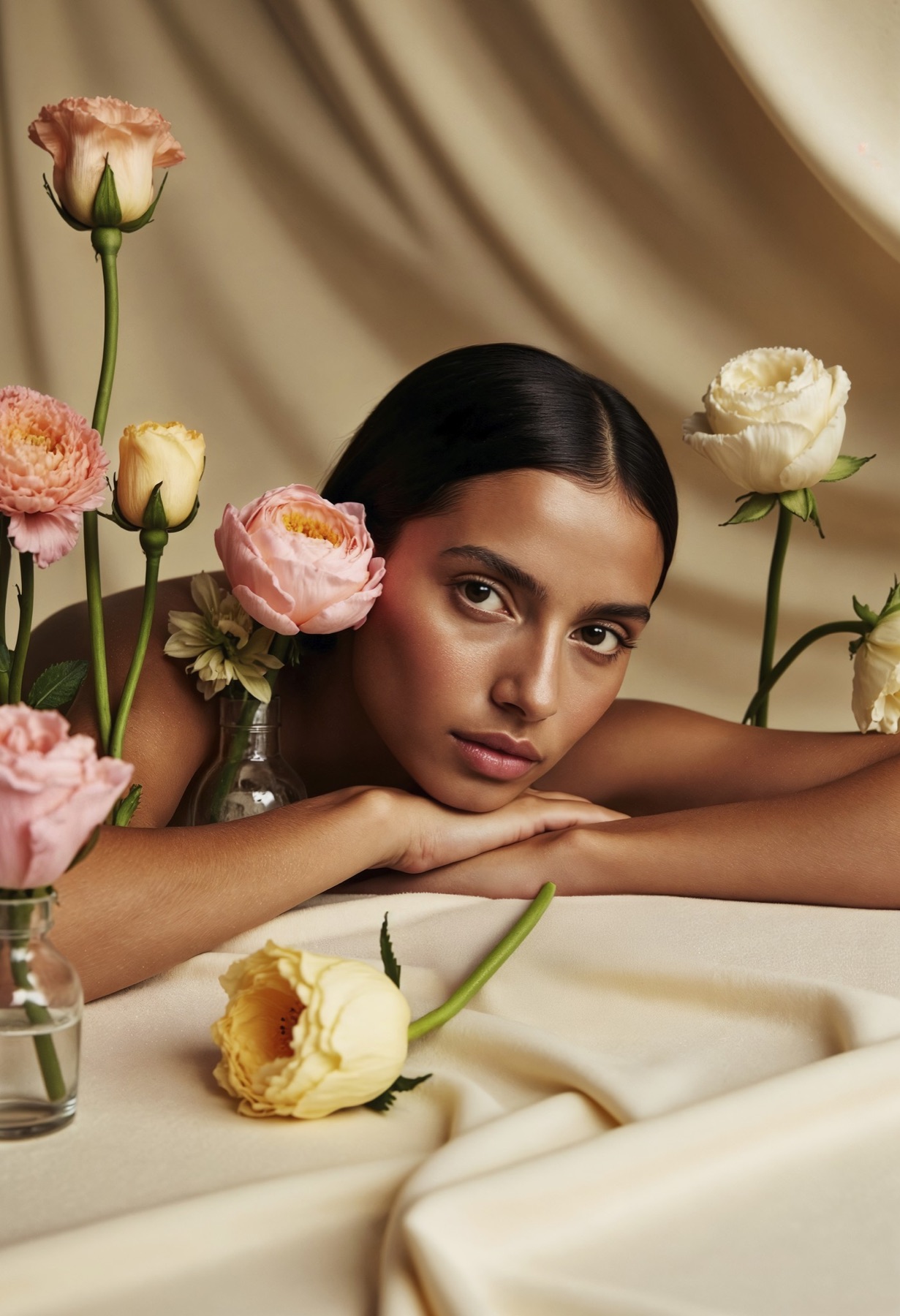 A client relaxing among roses in soft cream light