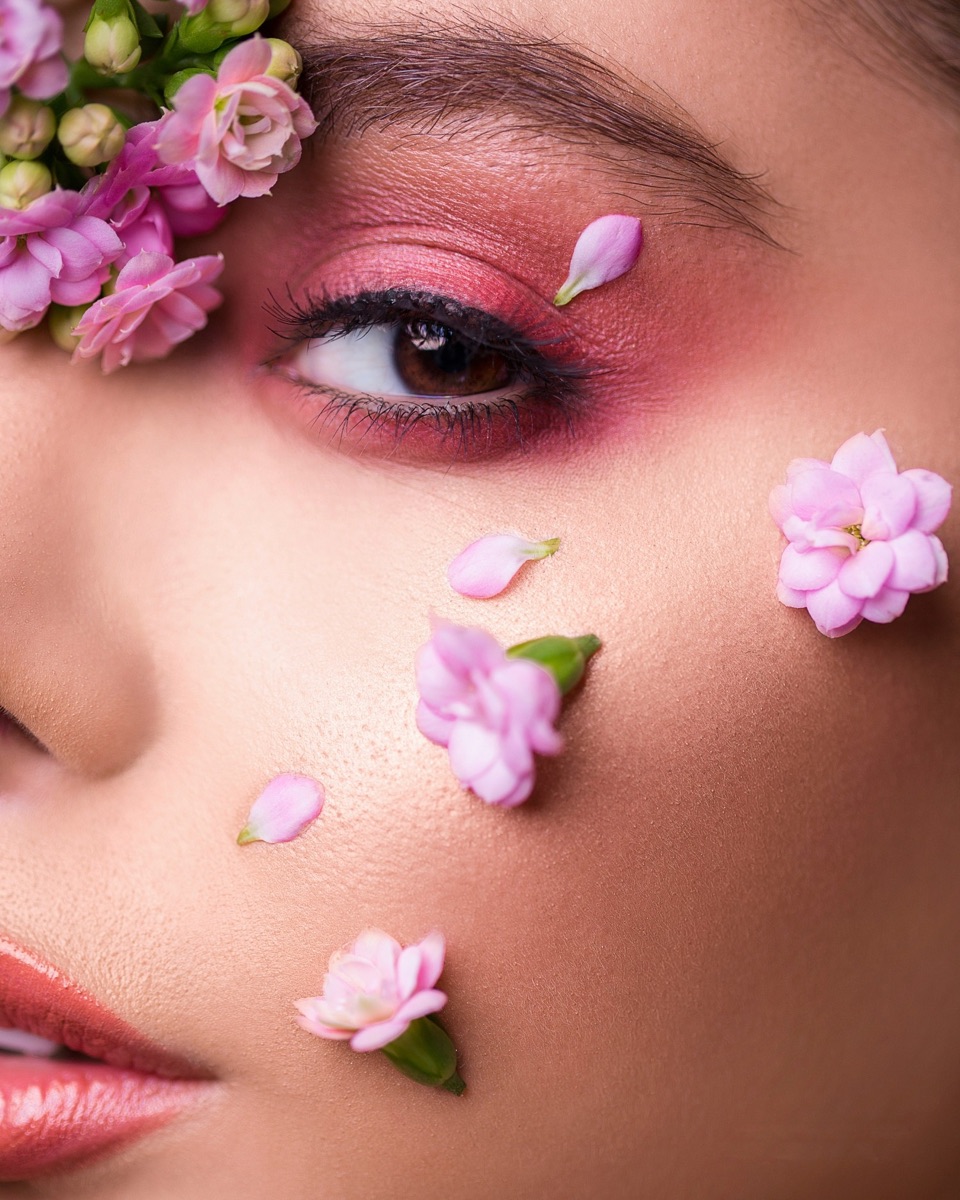 Soft pink makeup with flower petals