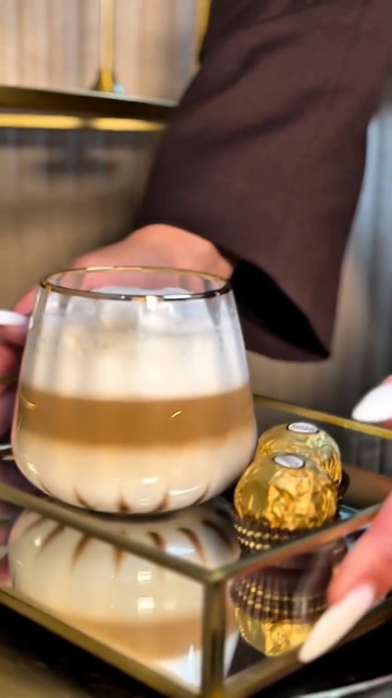 Coffee served on a gold tray at the salon